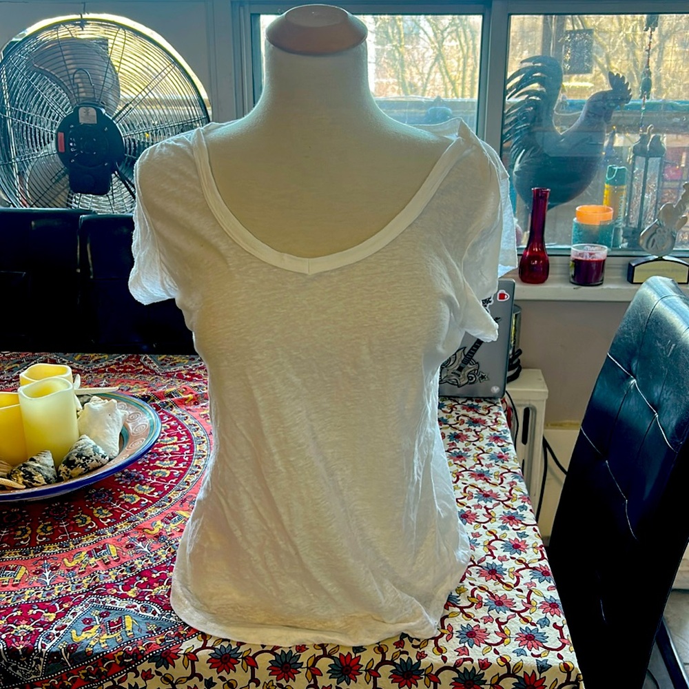 White semi translucent, loose v neck tee size Large